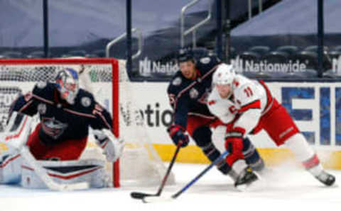 Feb 8, 2021; Columbus, Ohio, USA; Carolina Hurricanes center Jordan Staal (11) moves in for a shot against Columbus Blue Jackets defenseman Michael Del Zotto (15) during the second period at Nationwide Arena. Mandatory Credit: Russell LaBounty-USA TODAY Sports