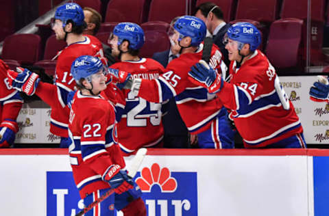 MONTREAL, QC – FEBRUARY 17: Cole Caufield #22 of the Montreal Canadiens celebrates a late third period goal with teammates on the bench against the St. Louis Blues at Centre Bell on February 17, 2022 in Montreal, Canada. The Montreal Canadiens defeated the St. Louis Blues 3-2 in overtime. (Photo by Minas Panagiotakis/Getty Images)