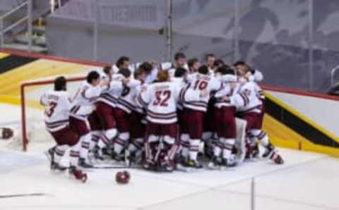 PITTSBURGH, PA – APRIL 10: Filip Lindberg #35 of the Massachusetts Minutemen and his teammates celebrate a 5-0 victory against the St. Cloud State Huskies capturing the first NCAA hockey championship in school history during the 2021 NCAA Division I Men’s Hockey Frozen Four Championship final at the PPG Paints Arena on April 10, 2021 in Pittsburgh, Pennsylvania. (Photo by Richard T Gagnon/Getty Images)