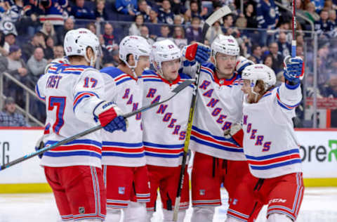 Jesper Fast (left) and teammates celebrate a goal. (Photo by Darcy Finley/NHLI via Getty Images)