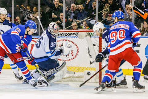 NEW YORK, NY – MARCH 06: New York Rangers left wing Jimmy Vesey (26) and New York Rangers center Vladislav Namestnikov (90) look for rebound to score as Winnipeg Jets goaltender Steve Mason (35) tracks loose puck during the Winnipeg Jets and New York Rangers NHL game on March 6, 2018, at Madison Square Garden in New York, NY. (Photo by John Crouch/Icon Sportswire via Getty Images)