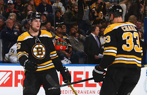 BUFFALO, NY – DECEMBER 27: Brandon Carlo #25 of the Boston Bruins celebrates his late third period goal with Zdeno Chara #33 during an NHL game against the Buffalo Sabres on December 27, 2019 at KeyBank Center in Buffalo, New York. Boston won 3-0. (Photo by Rob Marczynski/NHLI via Getty Images)