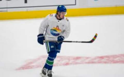 Mar 11, 2022; Vancouver, British Columbia, CAN; Vancouver Canucks defenseman Quinn Hughes (43) during warm up prior to a game against the Washington Capitals at Rogers Arena. The Canucks are wearing colorful Pride jerseys in celebration of Vancouver’s 2SLGBTQ community. Mandatory Credit: Bob Frid-USA TODAY Sports