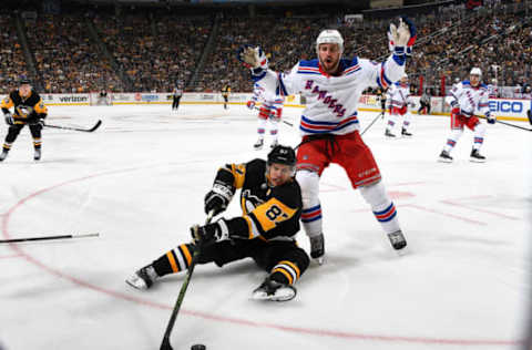 PITTSBURGH, PA – APRIL 06: Sidney Crosby #87 of the Pittsburgh Penguins handles the puck in front of Brendan Smith #42 of the New York Rangers at PPG Paints Arena on April 6, 2019 in Pittsburgh, Pennsylvania. (Photo by Joe Sargent/NHLI via Getty Images)