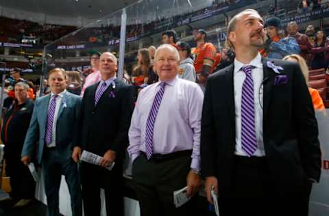 ANAHEIM, CA – OCTOBER 15: Head coach of the Anaheim Ducks, Randy Carlyle, center, and assistant coaches, Steve Konowalchuk, Trent Yawney, and Mark Morrison wear purple ties in support of Hockey Fights Cancer Night. (Photo by Debora Robinson/NHLI via Getty Images)