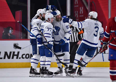 MONTREAL, QC – APRIL 28: Jake Muzzin #8 of the Toronto Maple Leafs celebrates his goal with teammates Adam Brooks #77, . (Photo by Minas Panagiotakis/Getty Images)