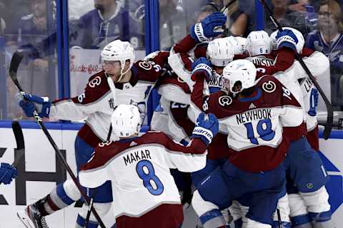 TAMPA, FLORIDA – JUNE 22: Nazem Kadri #91 of the Colorado Avalanche celebrates with teammates after scoring a goal against Andrei Vasilevskiy #88 of the Tampa Bay Lightning to win 3-2 overtime in Game Four of the 2022 NHL Stanley Cup Final at Amalie Arena on June 22, 2022 in Tampa, Florida. (Photo by Douglas P. DeFelice/Getty Images)