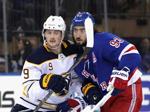 Jack Eichel #9 of the Buffalo Sabres goes up against Mika Zibanejad #93 of the New York Rangers (Photo by Bruce Bennett/Getty Images)