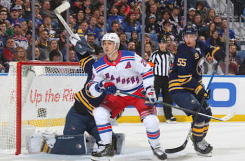 BUFFALO, NY – FEBRUARY 15: Chris Kreider #20 of the New York Rangers is defended by Linus Ullmark #35 and Rasmus Ristolainen #55 of the Buffalo Sabres during an NHL game on February 15, 2019 at KeyBank Center in Buffalo, New York. (Photo by Rob Marczynski/NHLI via Getty Images)