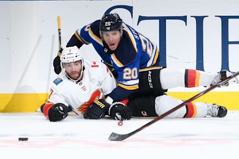 ST. LOUIS, MO – OCTOBER 11: TJ Brodie #7 of the Calgary Flames and Alexander Steen #20 of the St. Louis Blues watch the puck at Enterprise Center on October 11, 2018 in St. Louis, Missouri. (Photo by Scott Rovak/NHLI via Getty Images)