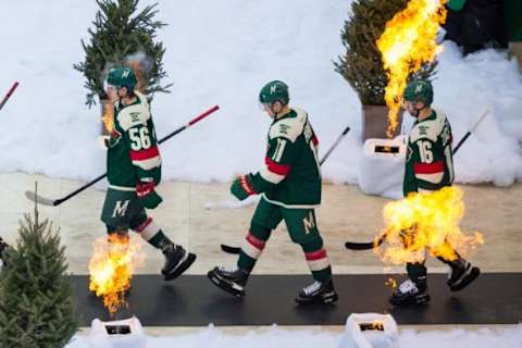 Feb 21, 2016; Minneapolis, MN, USA; Minnesota Wild forward Erik Haula (56) and forward Zach Parise (11) and forward Jason Zucker (16) enter the stadium before the game against the Chicago Blackhawks during a Stadium Series hockey game at TCF Bank Stadium. Mandatory Credit: Brad Rempel-USA TODAY Sports