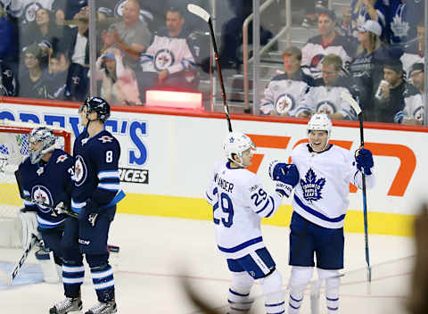 WINNIPEG, MB – OCTOBER 4: Auston Matthews #34 of the Toronto Maple Leafs celebrates his third period goal against the Winnipeg Jets with teammate William Nylander #29 at the Bell MTS Place on October 4, 2017 in Winnipeg, Manitoba, Canada. (Photo by Darcy Finley/NHLI via Getty Images)