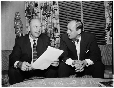 Buzzie Bavasi, right, signing field manager Walter Alston to a new contract in 1957. (Photo by Los Angeles Examiner/USC Libraries/Corbis via Getty Images)