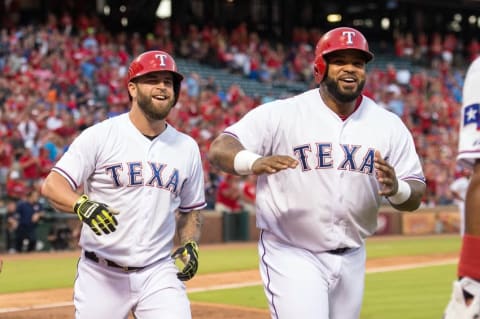 Sep 16, 2015; Arlington, TX, USA; Texas Rangers left fielder Mike Napoli (25) and designated hitter Prince Fielder (84) come off the field after Napoli hits a three run home run against the Houston Astros during the first inning Globe Life Park in Arlington. Mandatory Credit: Jerome Miron-USA TODAY Sports. MLB.