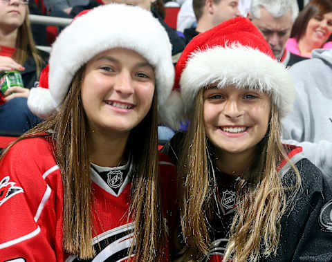 RALEIGH, NC – DECEMBER 18: Carolina Hurricanes fans display their holiday spirit as they wait for puck drop prior to an NHL game against the Toronto Maple Leafs at PNC Arena on December 18, 2014 in Raleigh, North Carolina. (Photo by Gregg Forwerck/NHLI via Getty Images)