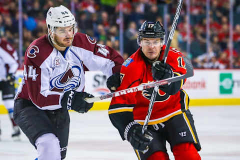 Mar 18, 2016; Calgary, Alberta, CAN; Calgary Flames left wing Lance Bouma (17) and Colorado Avalanche defenseman Eric Gelinas (44) fight for position during the second period at Scotiabank Saddledome. Mandatory Credit: Sergei Belski-USA TODAY Sports