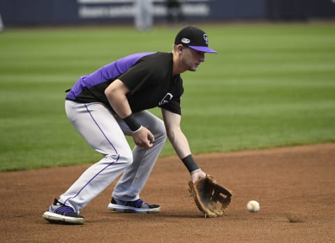 MILWAUKEE, WI – OCTOBER 04: Colorado Rockies third baseman Ryan McMahhon (24) scoops up a ball during batting practice at Miller Park before the Rockies played the Milwaukee Brewers for the first game of the NLDS October 04, 2018. (Photo by Andy Cross/The Denver Post via Getty Images)