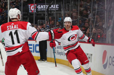 DENVER, CO – MARCH 11: Dougie Hamilton #19 of the Carolina Hurricanes celebrates with teammate Jordan Staal #11 after scoring a goal against the Colorado Avalanche at the Pepsi Center on March 11, 2019 in Denver, Colorado. (Photo by Michael Martin/NHLI via Getty Images)