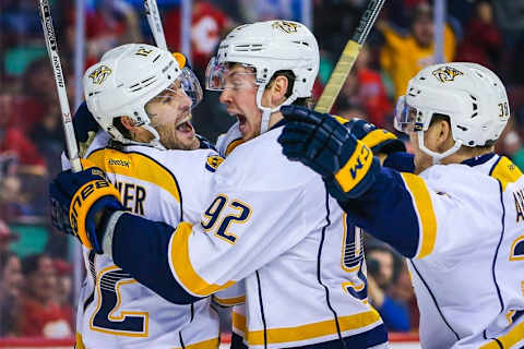 Mar 9, 2016; Calgary, Alberta, CAN; Nashville Predators center Mike Fisher (12) celebrates his goal with teammates against the Calgary Flames during the third period at Scotiabank Saddledome. Calgary won 3-2. Mandatory Credit: Sergei Belski-USA TODAY Sports