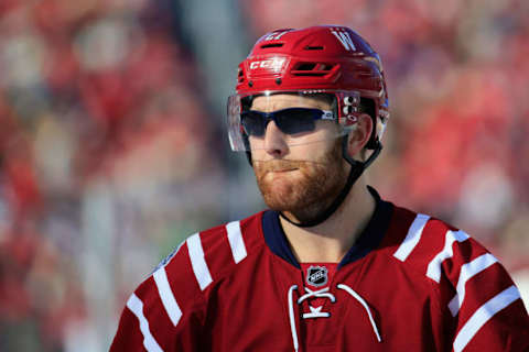 WASHINGTON, DC – JANUARY 01: Karl Alzner #27 of the Washington Capitals wears sunglasses during warm ups for the 2015 NHL Winter Classic against the Chicago Blackhawks at Nationals Park on January 1, 2015 in Washington, DC. (Photo by Rob Carr/Getty Images)