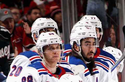 NEWARK, NEW JERSEY – APRIL 18: (L-R) Patrick Kane #88, Artemi Panarin and Mika Zibanejad #93 of the New York Rangers watch the closing minute of play against the New Jersey Devils during Game One in the First Round of the 2023 Stanley Cup Playoffs at the Prudential Center on April 18, 2023, in Newark, New Jersey. (Photo by Bruce Bennett/Getty Images)