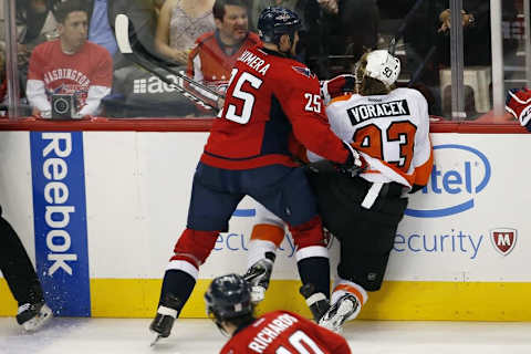 Apr 22, 2016; Washington, DC, USA; Washington Capitals left wing Jason Chimera (25) boards Philadelphia Flyers left wing Jakub Voracek (93) in the third period in game five of the first round of the 2016 Stanley Cup Playoffs at Verizon Center. The Flyers won 2-0, and the Capitals lead the series 3-2. Mandatory Credit: Geoff Burke-USA TODAY Sports