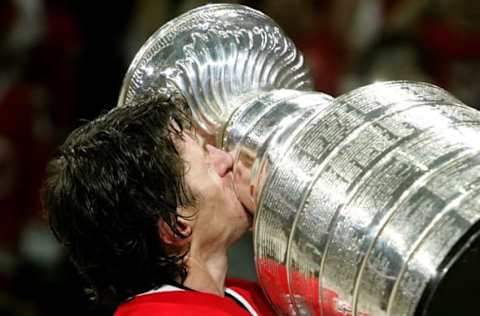 RALEIGH, NC – JUNE 19: Rod Brind’Amour #17 of the Carolina Hurricanes kisses the Stanley Cup after defeating the Edmonton Oilers in game seven of the 2006 NHL Stanley Cup Finals on June 19, 2006 at the RBC Center in Raleigh, North Carolina. The Hurricanes defeated the Oilers 3-1 to win the Stanley Cup finals 4 games to 3. (Photo by Jim McIsaac/Getty Images)