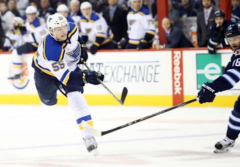 Oct 18, 2015; Winnipeg, Manitoba, CAN; St. Louis Blues defenseman Colton Parayko (55) has his shot tipped past Winnipeg Jets goalie Ondrej Pavelec (not shown) by St. Louis Blues defenseman Carl Gunnarsson (not pictured) during the third period at the MTS Centre. St. Louis Blues win 4-2. Mandatory Credit: Bruce Fedyck-USA TODAY Sports