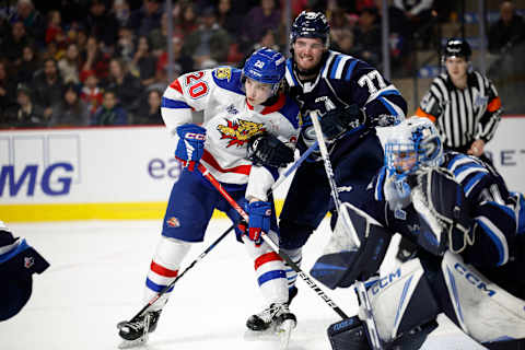 Matteo Mann battles with Preston Lounsbury in the Sagueneens’ crease. (Photo by Dale Preston/Getty Images)