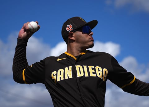 Feb 26, 2023; Peoria, Arizona, USA; San Diego Padres third baseman Manny Machado (13) warms up prior to facing the Arizona Diamondbacks at Peoria Sports Complex. Mandatory Credit: Joe Camporeale-USA TODAY Sports