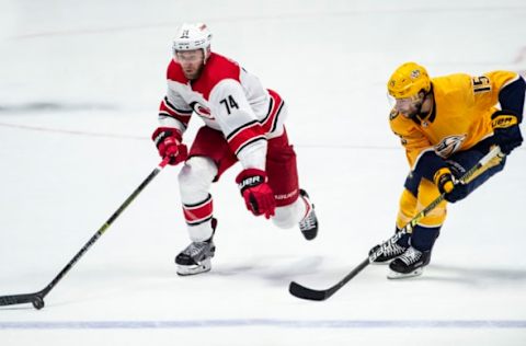 NASHVILLE, TN – MARCH 9: Jaccob Slavin #74 of the Carolina Hurricanes skates against Craig Smith #15 of the Nashville Predators at Bridgestone Arena on March 9, 2019 in Nashville, Tennessee. (Photo by Ronald C. Modra/NHL/Getty Images)