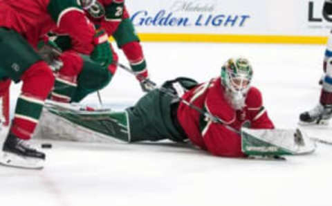 Sep 27, 2016; Saint Paul, MN, USA; Minnesota Wild goalie Devan Dubnyk (40) makes a save during the first period of a preseason hockey game against the Colorado Avalanche at Xcel Energy Center. Mandatory Credit: Brace Hemmelgarn-USA TODAY Sports