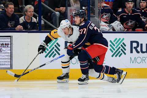 Oct 22, 2022; Columbus, Ohio, USA; Pittsburgh Penguins center Evgeni Malkin (71) skates against Columbus Blue Jackets defenseman Nick Blankenburg (77) in the first period at Nationwide Arena. Mandatory Credit: Aaron Doster-USA TODAY Sports