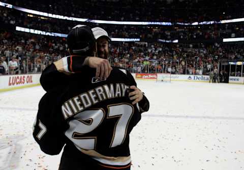 Brothers Scott Niedemayer (27) and Rob embrace after the Anaheim Ducks became the first West Coast team to win the Stanly Cup after beating the Ottawa Senators 6?2 in game 5 at the Honda Center. (Photo by Wally Skalij/Los Angeles Times via Getty Images)