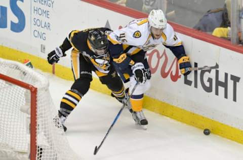 May 29, 2017; Pittsburgh, PA, USA; Nashville Predators left wing Pontus Aberg (46) battles for the puck with Pittsburgh Penguins defenseman Justin Schultz (4) during the third period in game one of the 2017 Stanley Cup Final at PPG PAINTS Arena. Mandatory Credit: Don Wright-USA TODAY Sports