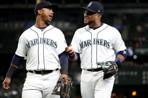 SEATTLE, WA – SEPTEMBER 27: Jean Segura #2 (L) and Robinson Cano #22 of the Seattle Mariners have a conversation while walking back to the dugout after the fifth inning during their game at Safeco Field on September 27, 2018 in Seattle, Washington. (Photo by Abbie Parr/Getty Images)