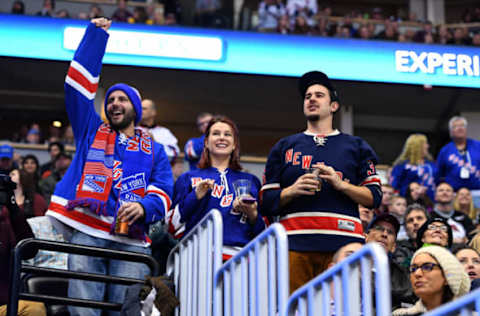 Dec 31, 2016; Denver, CO, USA; New York Rangers fans react to a goal by left wing Chris Kreider (not pictured) in the first period against the Colorado Avalanche at Pepsi Center. Mandatory Credit: Ron Chenoy-USA TODAY Sports