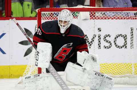 RALEIGH, NC – MARCH 16: Curtis McElhinney #35 of the Carolina Hurricanes crouches in the crease to protect the net during an NHL game against the Buffalo Sabres on March 16, 2019 at PNC Arena in Raleigh, North Carolina. (Photo by Gregg Forwerck/NHLI via Getty Images)