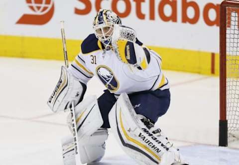 Mar 19, 2016; Toronto, Ontario, CAN; Buffalo Sabres goaltender Chad Johnson (31) makes a save during the pre game warm up against the Toronto Maple Leafs at the Air Canada Centre. Mandatory Credit: John E. Sokolowski-USA TODAY Sports