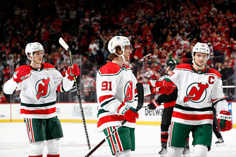 John Marino #6 and Nico Hischier #13 celebrate with Dawson Mercer #91. (Photo by Sarah Stier/Getty Images)