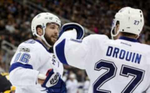 Mar 3, 2017; Pittsburgh, PA, USA; Tampa Bay Lightning right wing Nikita Kucherov (86) celebrates his goal with left wing Jonathan Drouin (27) against the Pittsburgh Penguins during the third period at the PPG PAINTS Arena. The Penguins won 5-2. Mandatory Credit: Charles LeClaire-USA TODAY Sports