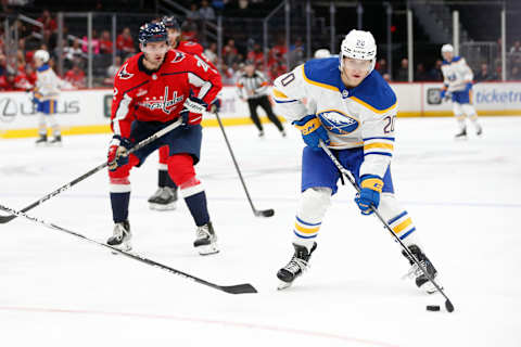 Sep 24, 2023; Washington, District of Columbia, USA; Buffalo Sabres forward Jiri Kulich (20) controls the puck in front of Washington Capitals defenseman Vincent Iorio (2) during the second period at Capital One Arena. Mandatory Credit: Amber Searls-USA TODAY Sports