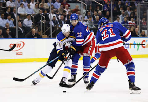 NEW YORK, NEW YORK – MARCH 03: Oskar Sundqvist #70 of the St. Louis Blues and Filip Chytil #72 of the New York Rangers battle for the puck during their game at Madison Square Garden on March 03, 2020 in New York City. (Photo by Al Bello/Getty Images)