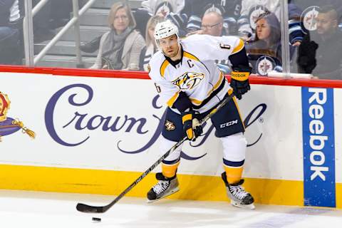 WINNIPEG, CANADA – OCTOBER 17: Shea Weber #6 of the Nashville Predators plays the puck along the boards during second period action against the Winnipeg Jets on October 17, 2014 at the MTS Centre in Winnipeg, Manitoba, Canada. The Preds defeated the Jets 2-0. (Photo by Jonathan Kozub/NHLI via Getty Images)