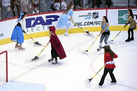 Oct 30, 2015; Glendale, AZ, USA; Arizona Coyotes Paw Patrol ice crew clean the ice in Halloween costumes during the first period against the Vancouver Canucks at Gila River Arena. Mandatory Credit: Matt Kartozian-USA TODAY Sports