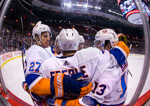 VANCOUVER, BC – MARCH 05: New York Islanders Left Wing Anders Lee (27) and Center John Tavares (91) and Right Wing Jordan Eberle (7) and Center Mathew Barzal (13) and Right Wing Josh Bailey (12) celebrate Eberle’s goal against the Vancouver Canucks during the third period in a NHL hockey game on March 05, 2018, at Rogers Arena in Vancouver, BC. The Canucks won 4-3 in overtime. (Photo by Bob Frid/Icon Sportswire via Getty Images)