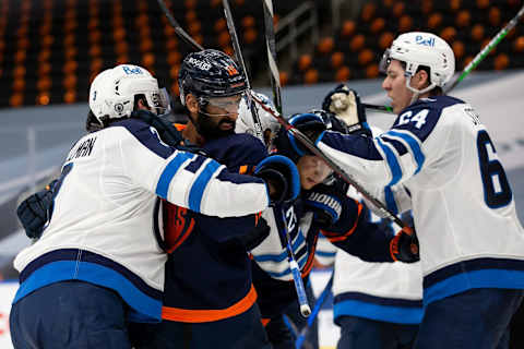 Winnipeg Jets, Tucker Poolman#3 and Logan Stanley #64; Jujhar Khaira #16, Edmonton Oilers (Photo by Codie McLachlan/Getty Images)