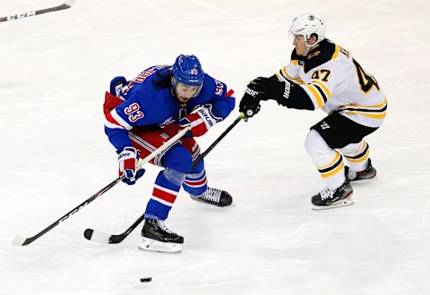 New York Rangers center Mika Zibanejad (93) plays the puck against Boston Bruins Mandatory Credit: Noah K. Murray-USA TODAY Sports