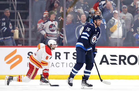 Apr 29, 2022; Winnipeg, Manitoba, CAN; Winnipeg Jets right wing Blake Wheeler (26) smiles after his first period goal against the Calgary Flames at Canada Life Centre. Mandatory Credit: James Carey Lauder-USA TODAY Sports