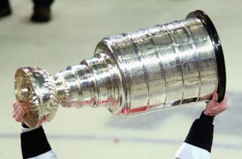 RALEIGH, NC – JUNE 19: Rod Brind’Amour #17 of the Carolina Hurricanes celebrates with the Stanley Cup after defeating the Edmonton Oilers in game seven of the 2006 NHL Stanley Cup Finals on June 19, 2006, at the RBC Center in Raleigh, North Carolina. The Hurricanes defeated the Oilers 3-1 to win the Stanley Cup finals 4 games to 3. (Photo by Grant Halverson/Getty Images)